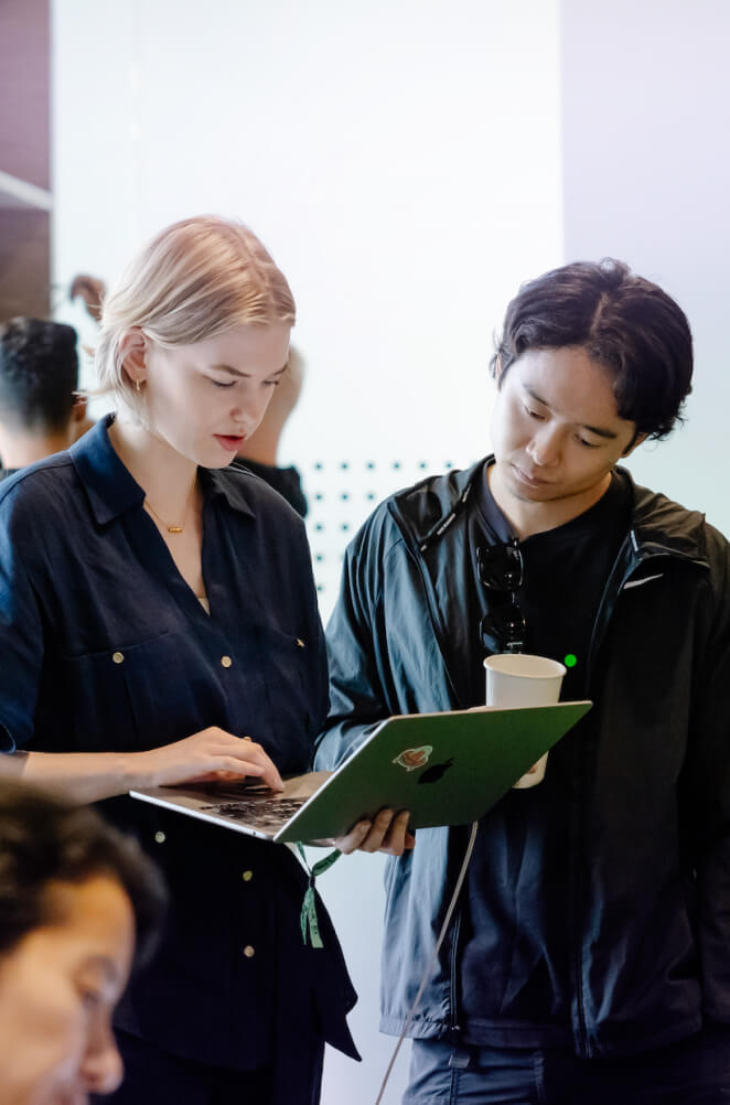 Participants working together on a laptop
